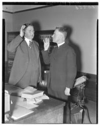 Father Albert Whelan and Judge Lile Jacks, swearing in a probation member