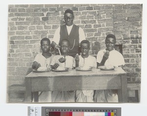 Young boys eating, Malawi, ca.1910