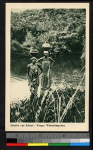 Two women standing with water jugs on their heads, Congo, ca.1920-1940