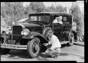 Putting air in tires, Southern California, 1931