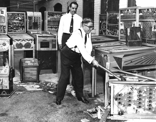 Biscailuz and aides destroy gambling equipment