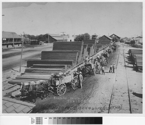 Boys, men, horses and wagons of watermelons line up in Turlock, California, circa 1909