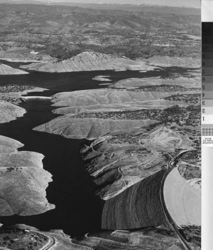 Aerial view of the disappearing old Don Pedro Dam, circa 1971