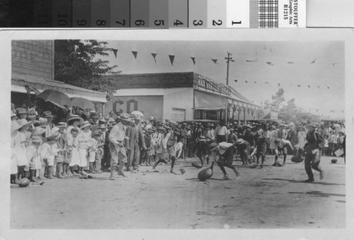 Boys in a watermelon rolling contest in Turlock, California, circa 1912