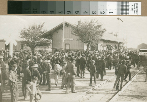 Prospective land buyers gather at the train station in Turlock, California, circa 1907