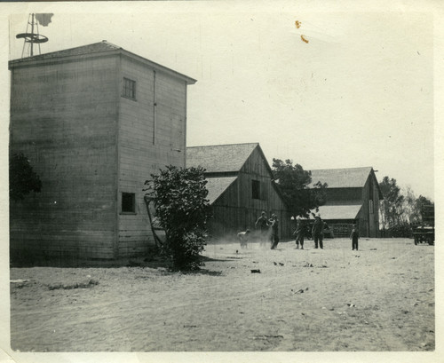 Boys play beside a two story tankhouse in Turlock, California, circa 1908