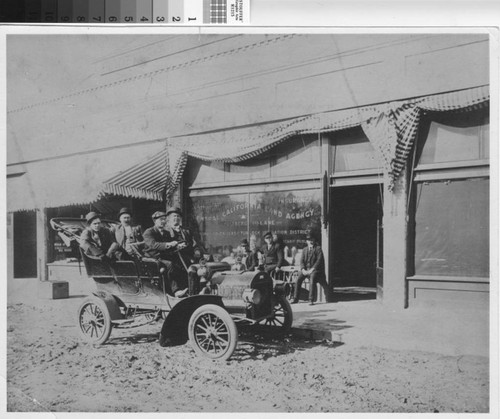 Unidentified men ride in one of Turlock's earliest automobiles, circa 1909