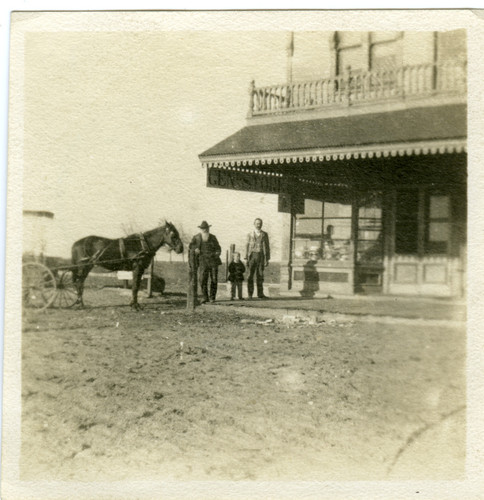 Photograph of Henry Osborn leaning against a hitching post in Turlock, California, circa 1904