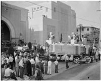 Crowds gather in Pasadena to see the arrival of the 200-inch lens for the future Hale Telescope, largest in the world when completed. April 10, 1936