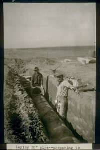 Laying 20" pipe--preparing to cover reinforced joint