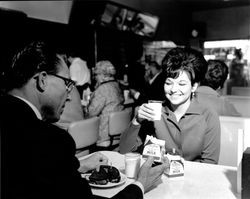 Don Heid and unidentified woman drinking Clover milk at Macs, Santa Rosa, California, January 18, 1968