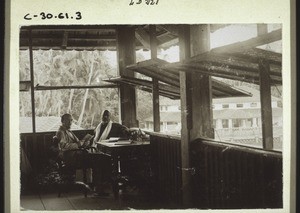Missionary with language teacher munshi on the veranda of the mission house in Kalikut