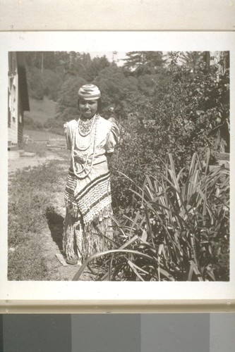 Patty Lopez in ceremonial costume, Smith River, Calif. June 18, 1938