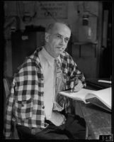 Poet E. B. Goodman writes with his left hand, El Centro, 1934