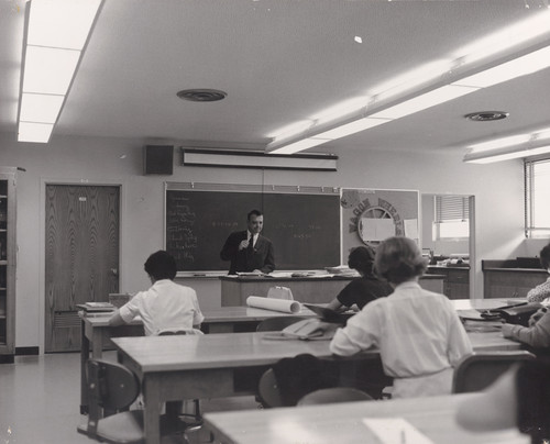 Photograph of instructor and students in classroom