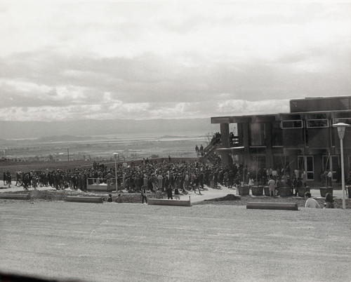 A large crowd gathers around for the dedication of the Student Union