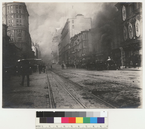 Emporium, crack in west wall. Ap. 18, 1906. [Market St. Call Building on fire in distance, left center.]