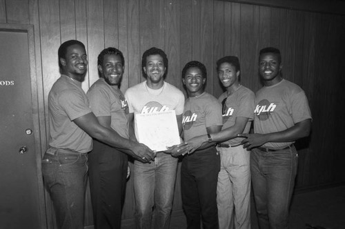 The Bolten Brothers posing with their album at KJLH, Los Angeles, 1987