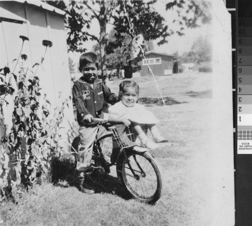 Photograph of Jacob and sister Linda Rasul in the Farm Labor Camp