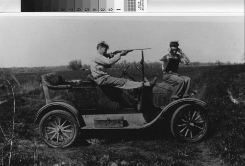 Photograph of two hunters on Model T at the Sunny Bank Farm in Nicolaus (Calif.)