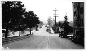 From center line of Franklin Avenue west of Whitley Avenue looking east showing descending grades into the intersection and restricted visibility, Los Angeles, 1928