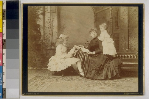 [Group portrait of Mrs. I.W. Taber with daughters Daisy, left, and Louise, right. Photograph by Isaiah West Taber.]