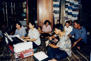 Congregation. From the Left: Beatrice Basalong, Jenny Thi, Sao Am with a guitar, and behind him