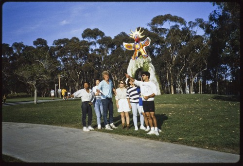 Sun God sculpture, students