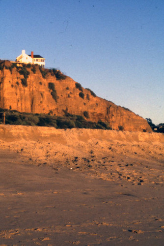 House on a cliff towering above Pacific Coast Highway, Santa Monica