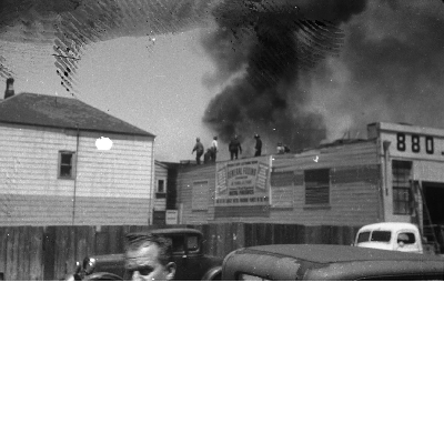 Firefighters on rooftop fighting fire