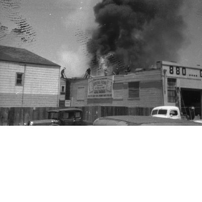 Firefighters on rooftop fighting fire