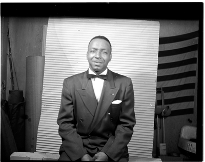 Portrait of man in bow tie seated