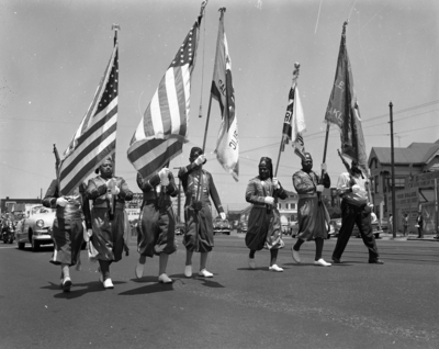 Masons carrying flags in parade