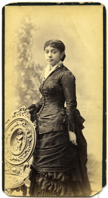 Portrait of unidentified woman wearing black dress