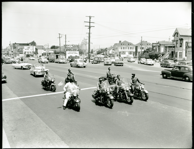 Berkeley Tigers Motorcycle Club riding in parade, Oakland, California