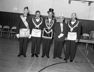 Al Fulcher (third from the left) and three men in mason regalia