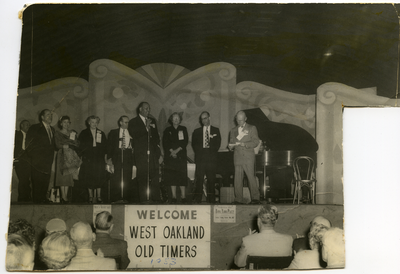 Royal Towns on stage at microphone at West Oakland Old Timers meeting