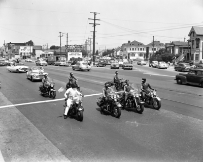 Berkeley Tigers Motorcycle Club riding in parade, Oakland, California