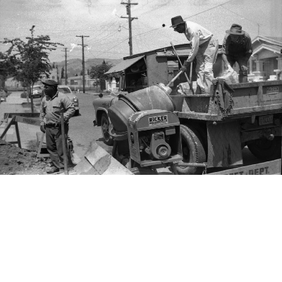 City of Oakland sidewalk crew mixing concrete