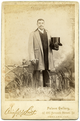 Portrait of unidentified man holding top hat and cane