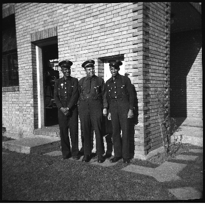 Royal Towns (center) and two Oakland firefighters standing outside of fire engine no. 22