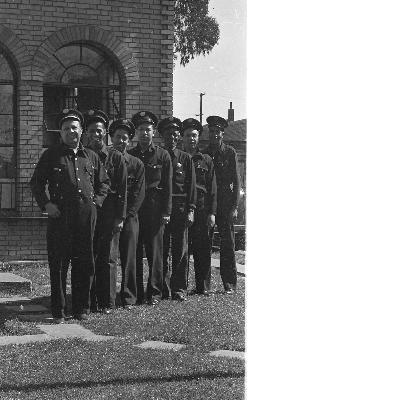 Group photograph of Oakland firefighters standing in front of fire engine no. 22