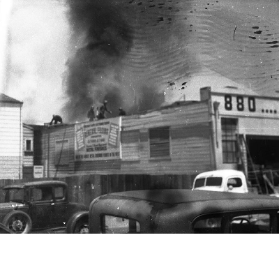 Firefighters on rooftop fighting fire