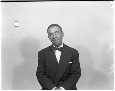 Portrait of man in bow tie seated