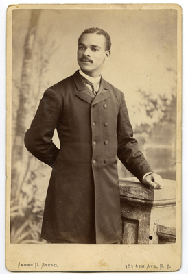 Portrait of unidentified man leaning on cornerstone