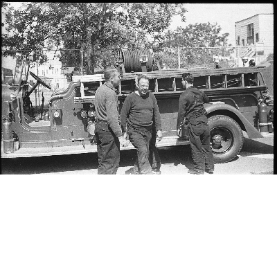 Royal Towns (center) and two Oakland firefighters standing next to fire engine