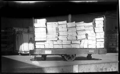 Cart stacked with bundled magazines