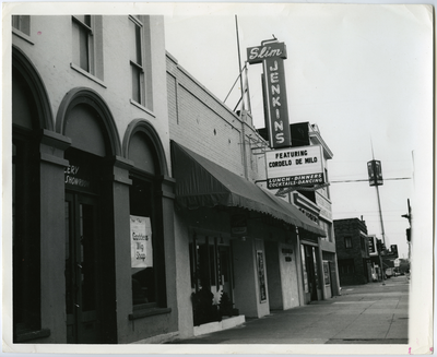 Exterior of Slim Jenkins sign reads 'featuring Cordelo de Milo