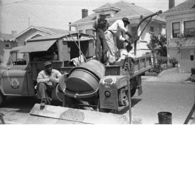 City of Oakland sidewalk crew mixing concrete