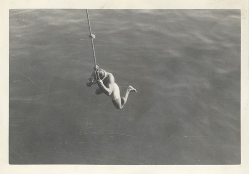 Unidentified man diving off wharf